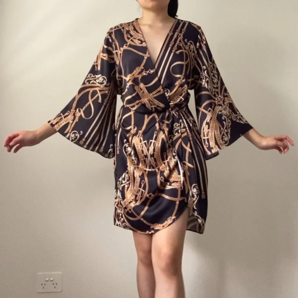 Sheike Black and Gold Wrap Dress - Picture 1 of 8